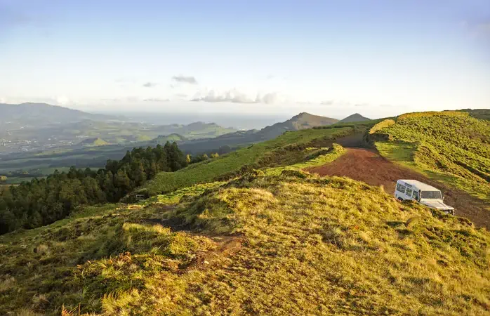 View of Mountains on the island of Sam Miguel, Azores in Portugal with blue sky and clouds overhead