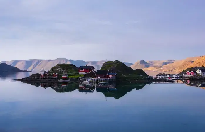 Lofoten Islands mirroring of reflecting red houses in water