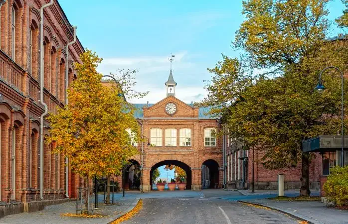 A clock tower above the entrance to old linen factory Tampella which is no longer in operation, but it is part of Tampere's industrial history as a notable manufacturing institution.
