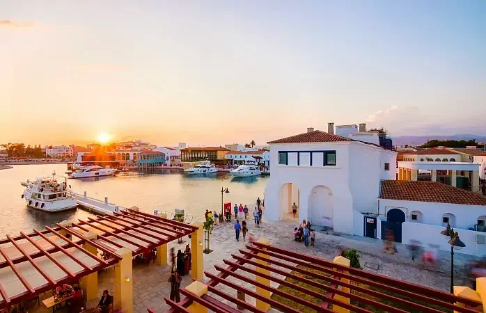 The beautiful Marina in Limassol city in Cyprus. A very modern, high end and newly developed area where yachts are moored and it's perfect for a waterfront promenade. A view of the commercial area at sunset.